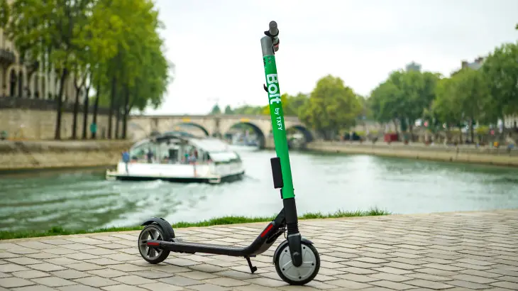 electric scooter beside a river